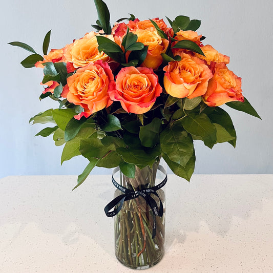 Two Dozen Premium Orange Roses in a Modern Vase